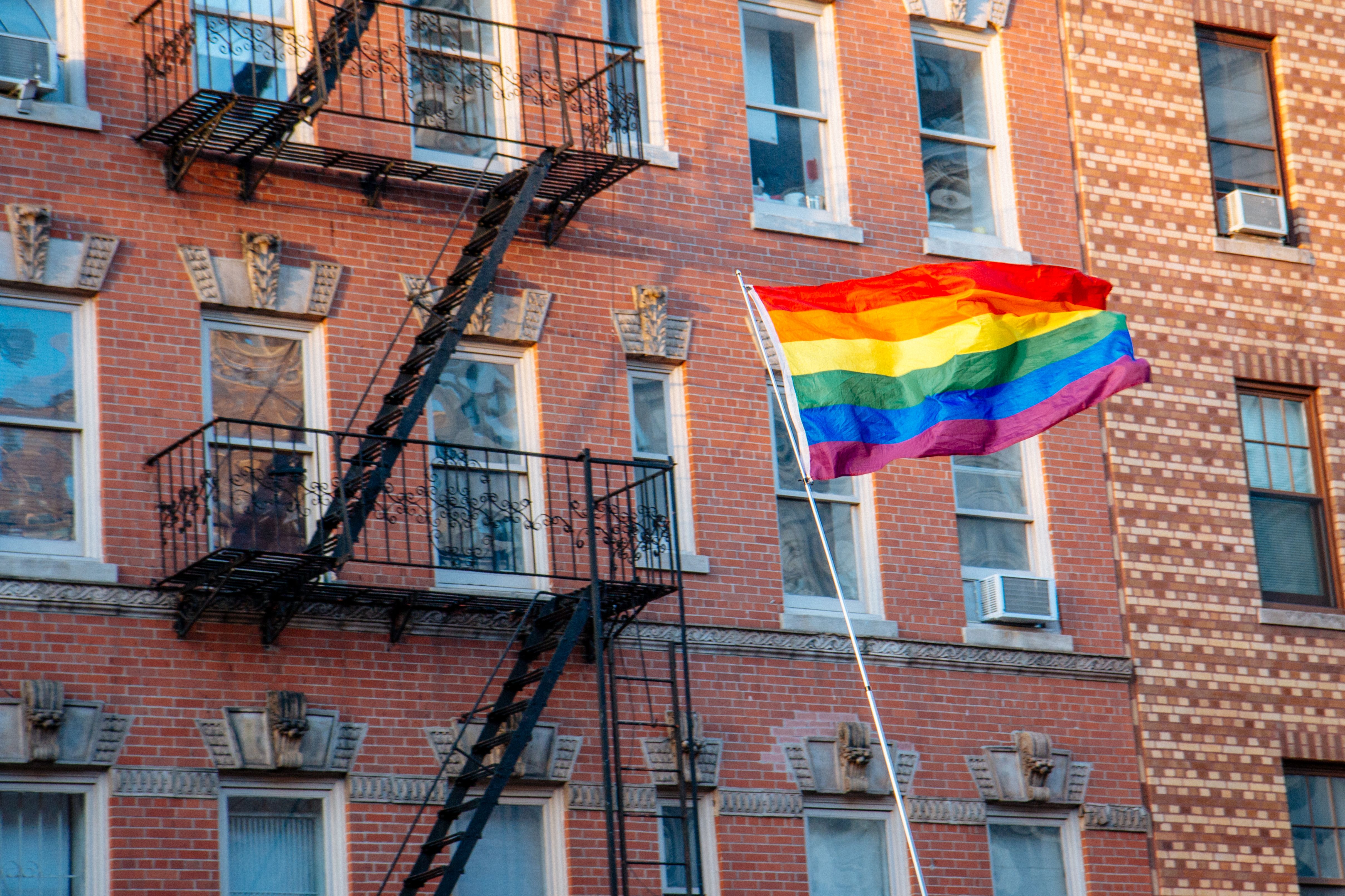The rainbow pride flag flying high in front of the Stonewall Inn in New York.